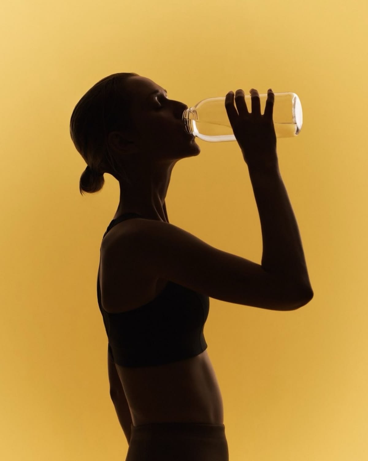 Woman drinking water to stay hydrated and keep breath fresh while travelling