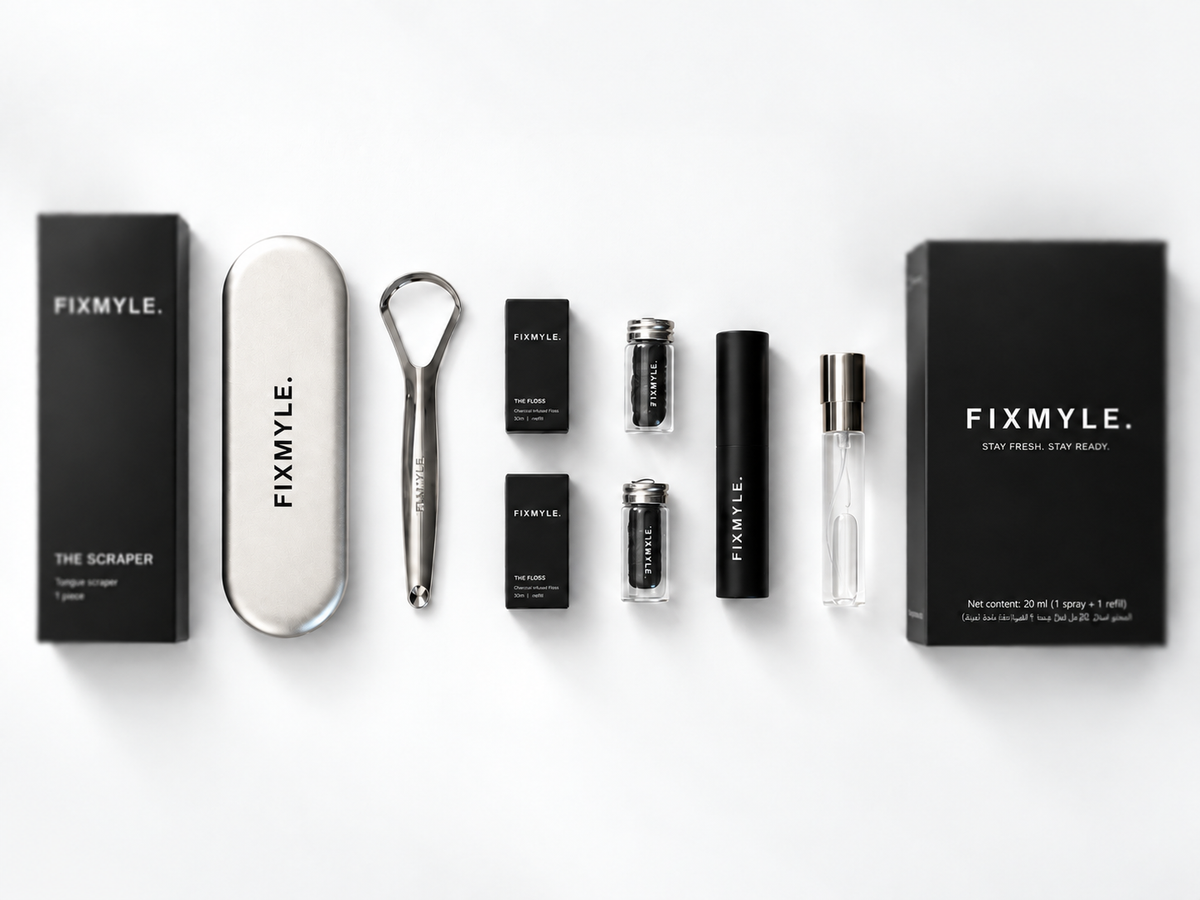 FIXMYLE Fresh Breath Routine flatlay: spray and refill, tongue scraper with case, and charcoal floss, for staying fresh before a stressful moment